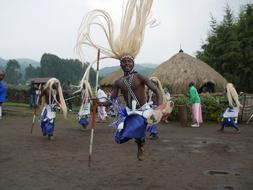 tribal African man dancing in village, Rwanda