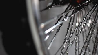 water droplets on the spokes of a bicycle