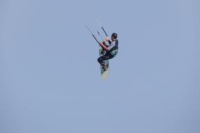 Kitesurfing, man with surfboard in Air