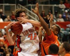 blocking a basketball player's hand on the field