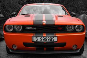 Beautiful, shiny, red and black "Dodge" car, with the number