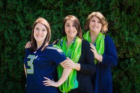 three young happy caucasian women together