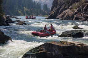 People, rafting in the beautiful, rocky river in Bear Trap Canyon, Montana, USA