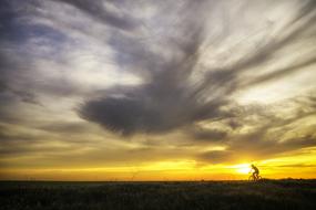 Landscape of Cycling person at the sunset