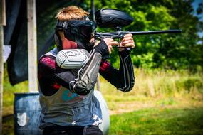 uniformed Paintball Player Shooting