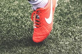 Football Shoe red and Grass