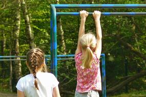 children doing gymnastics on the playground