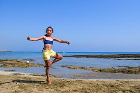 Girl yoga Beach sea