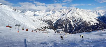 skiing on Snowy mountains peaks at Winter