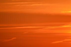 Beautiful, orange and red sunset in the sky with clouds