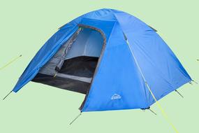 photo of blue tourist tent on green background