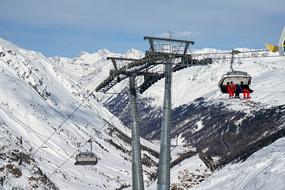 ski lift in the alps on a sunny day