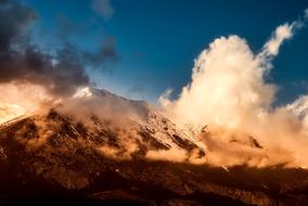 scenic landscape of mountains with cloudy sky