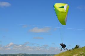 man is paragliding in france