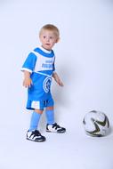 small child boy posing with ball