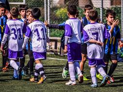 kids soccer teams in colorful uniforms