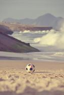 soccer ball on the beach at surfline