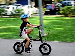 Boy ride Bicycle in park