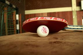 Table Tennis, paddle and ball close up