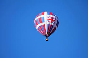 flying hot air balloon in the blue sky