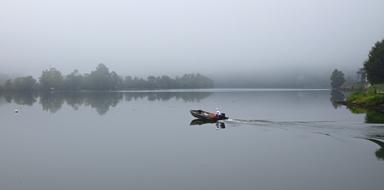 canoe on the river in the fog