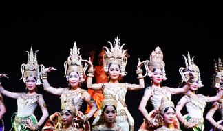 Girls, in the beautiful and colorful, decorated costumes, dancing in Cambodia