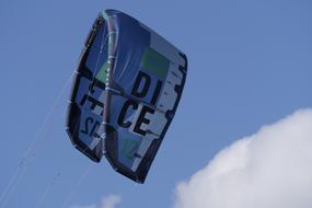 kitesurfing in the sky on a sunny day