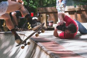 taking pictures of an athlete on a skateboard