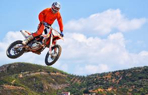 high jump in motocross on a sunny day