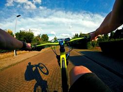 closeup photo of human on bike