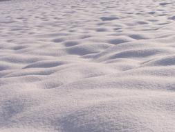 Beautiful, shiny white snow on the mountain, in light