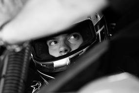 racer in helmet in black and white background