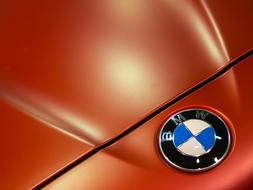 bmw logo on orange car hood