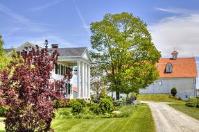 Colorful buildings, with the columns, among the colorful plants, in Ohio, USA