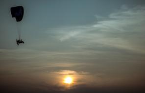 Paraglider Sky and orange Sun
