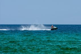 Jet Ski personal water craft speeding on sea