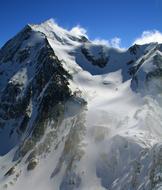 alpine Mountain summit covered with snow