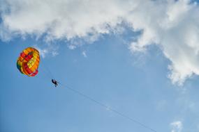 Parachute with rope at sky