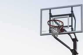 Basketball basket and grey sky