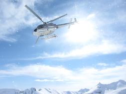 Flying helicopter, above the beautiful, snowy Canada Alaska mountains