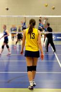 Volleyball playing girl in yellow t-shirt