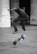 young boy jumping on Skateboard