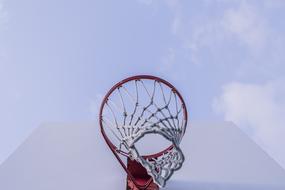 red basketball big ring against gray sky