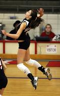 girl playing volleyball on a blurred background