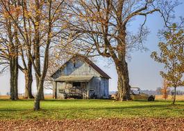 Rustic barn among the colorful plants on the beautiful landscape in Ohio