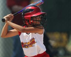 Female batter softball player on the competition