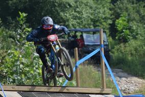 cyclist on sports Bike Jumps over obstacle