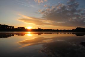 Sunrise of the sun on the lake