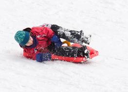 skiing with toboggan at Winter on Hill