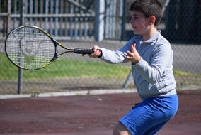 boy with a big racket